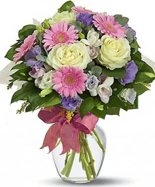 Roses and Gerberas Bouquet with Mixed seasonal Flowers decorated with greenery. Conveys love, purity and happiness. Suitable for occasions like births, love, congratulations, birthdays, weddings, anniversaries and inaugurations.