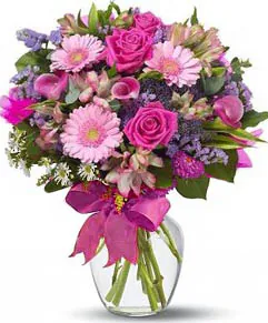 Roses and Gerberas Bouquet with Mixed seasonal Flowers decorated with greenery. Conveys love, purity and happiness. Suitable for occasions like births, love, congratulations, birthdays, weddings, anniversaries and inaugurations.