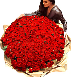 Luxurious arrangement of 200 Red Roses, decorated with seasonal greenery