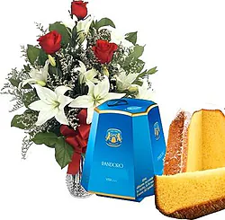 3 red roses and light-colored lilies with pandoro
