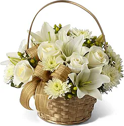 Basket of delicate roses, lilies and mixed flowers
