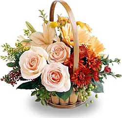 Basket of delicate roses, lilies, gerberas and mixed flowers