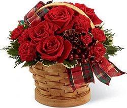 Basket of roses and mixed flowers in warm colors