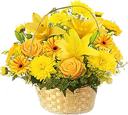 Basket of sunny roses, lilies, gerberas and mixed flowers
