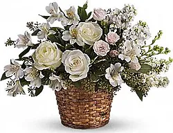 Basket of delicate roses, lisianthuses and mixed flowers
