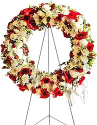 Bright funeral wreath of mixed flowers
