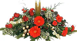 Christmas centerpiece of roses, gerberas and mixed flowers in warm colors
