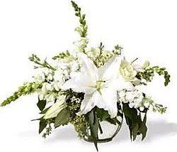 Delicate funeral bouquet of lilies, roses and mixed flowers
