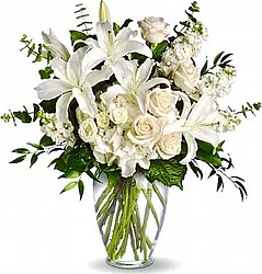 Mazzo Funebre di Roselline, Lisianthus e Lilium dai toni chiari in elegante confezione con verde decorativo