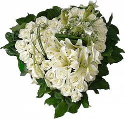 Delicate funeral heart of roses, lilies and mixed flowers