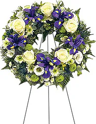 Delicate funeral wreath of roses, lisianthuses and mixed flowers