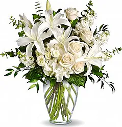 White Roses, lisianthuses and Lilies with seasonal greenery