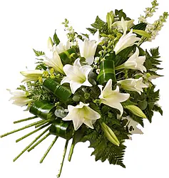 Fascio funebre di gigli o lilium e fiori misti dai toni chiari