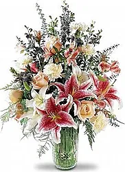 Mazzo funebre di lilium, rose e fiori misti dai toni delicati