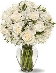 Funeral bunch of roses and mixed flowers in light colors