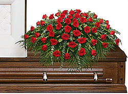 Funeral spray of red roses
