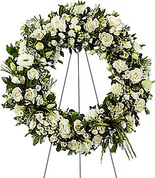 Funeral wreath of delicate roses and/or lisianthuses and mixed flowers