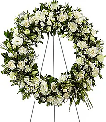 Corona funebre di rose e/o lisianthus e fiori misti dai toni chiari