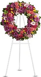 Funeral wreath of mixed flowers in intense colors