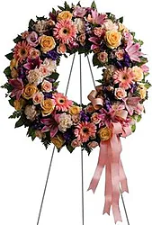 Funeral wreath of pastel roses, lilies, gerberas and mixed flowers