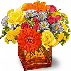 Gerberas or daisies, roses and mixed flowers in warm colors