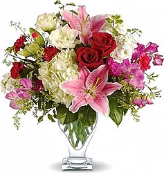 Lilies, roses, lisianthuses and mixed flowers in warm colors
