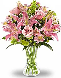 Lilium e Roselline dai toni Rosa in elegante confezione con verde misto decorativo