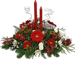Red and white Christmas centerpiece of gerberas and/or daisies and mixed flowers