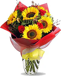 Sunflowers and Red Roses decorated with seasonal greenery
