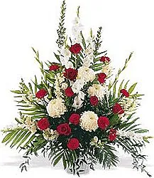 White and red funeral bowl of roses and mixed flowers